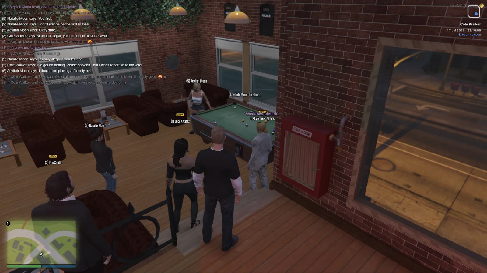 Players around a pool table in a bar with the roleplay chat log filling the left of the screen